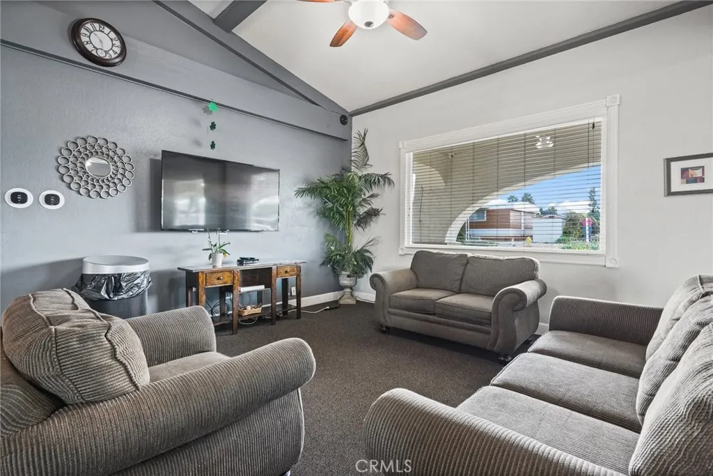 3033 E Valley, Unit 89 West Covina, CA 91792 - Photo 41 of 55 a living room with furniture and a flat screen tv