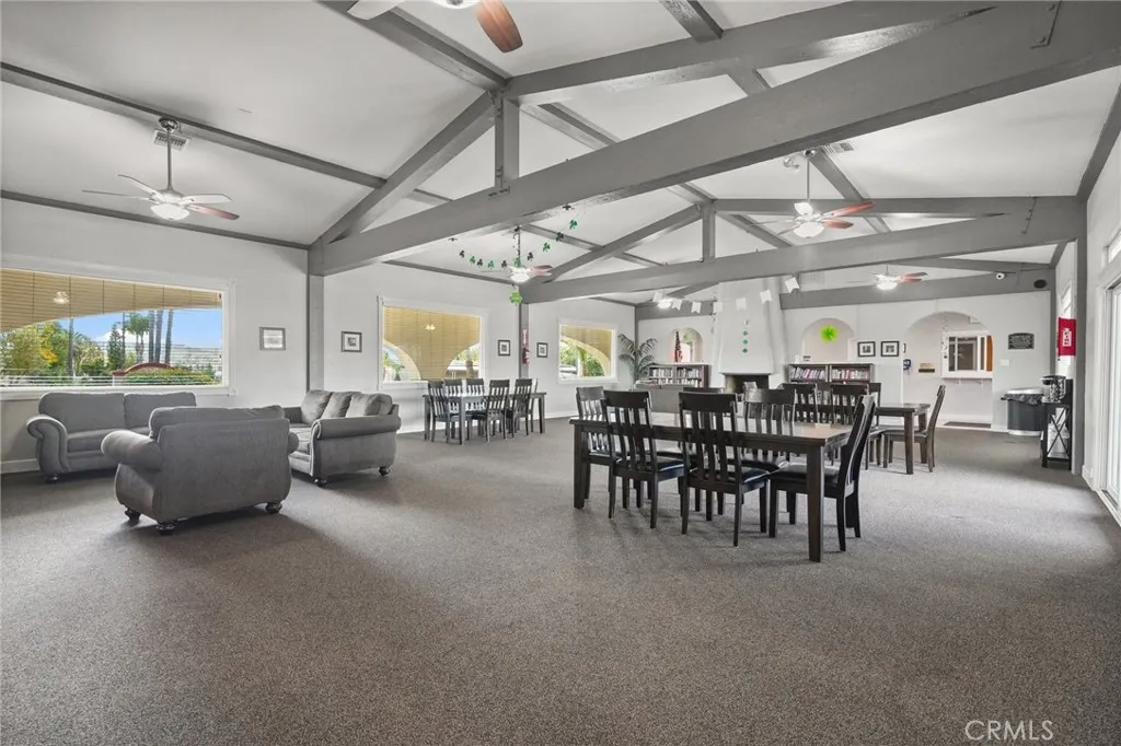 3033 E Valley, Unit 89 West Covina, CA 91792 - Photo 42 of 55 a dining room with furniture and a chandelier