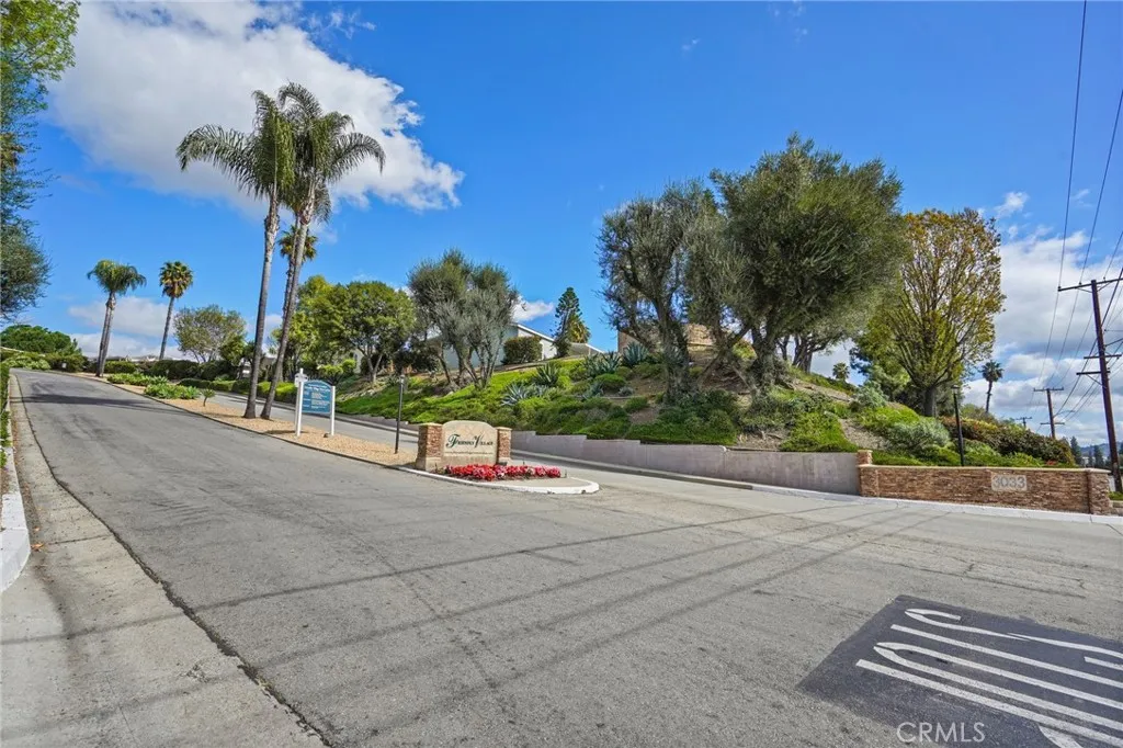 3033 E Valley, Unit 89 West Covina, CA 91792 - Photo 52 of 55 a view of a street with a cars parked on the road