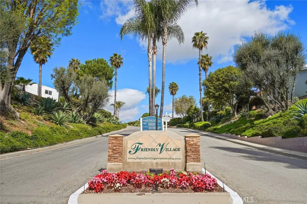 3033 E Valley, Unit 89 West Covina, CA 91792 - Photo 53 of 55 a view of a sign board with flower plants