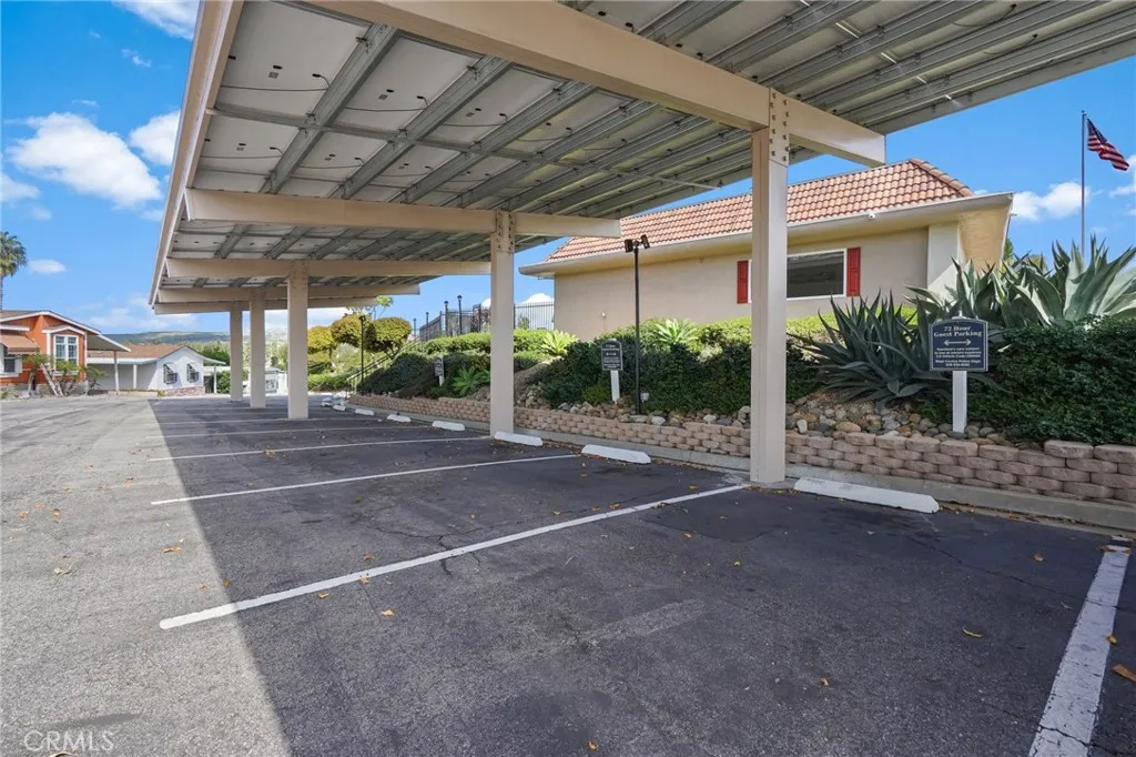3033 E Valley, Unit 89 West Covina, CA 91792 - Photo 54 of 55 a view of a patio with a table and chairs under an umbrella
