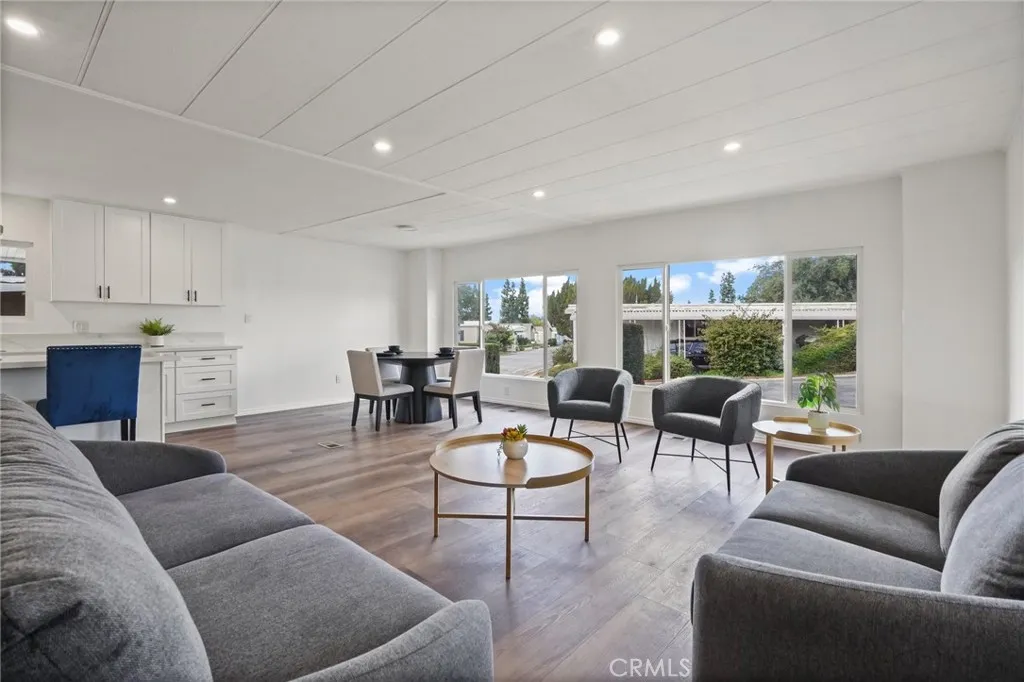 3033 E Valley, Unit 89 West Covina, CA 91792 - Photo 10 of 55 a living room with furniture and a large window