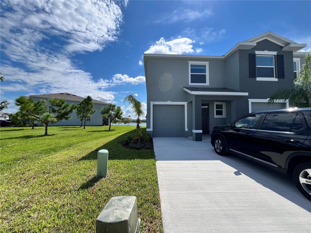 137 Mangrove Shade Circle Apollo Beach, FL 33572 - Photo 1 of 31 a house view with a garden space