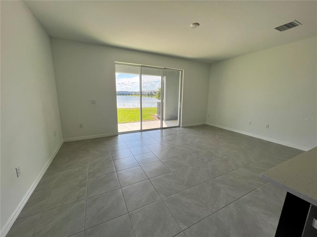 137 Mangrove Shade Circle Apollo Beach, FL 33572 - Photo 13 of 31 a view of an empty room with a window