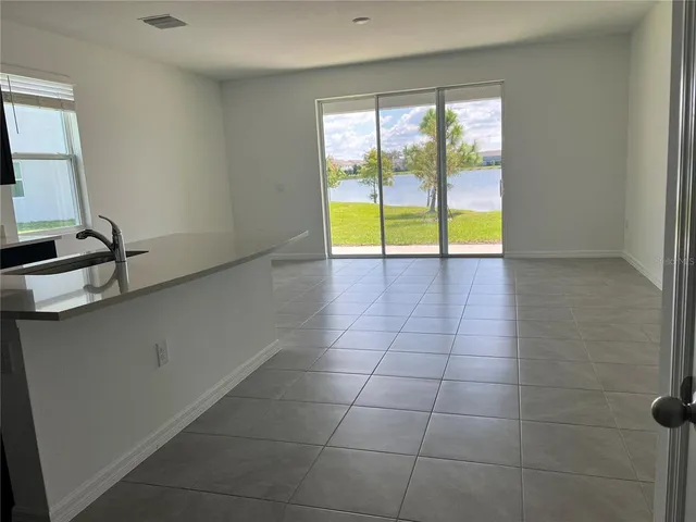 a view of an empty room and window