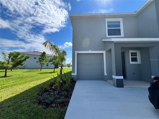 a view of a back yard of the house