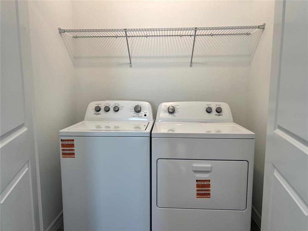 137 Mangrove Shade Circle Apollo Beach, FL 33572 - Photo 24 of 31 a utility room with dryer and washer
