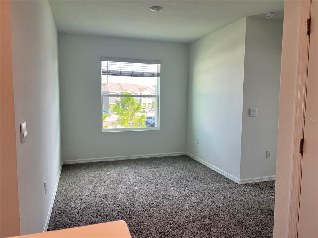 137 Mangrove Shade Circle Apollo Beach, FL 33572 - Photo 25 of 31 a view of an empty room and a window