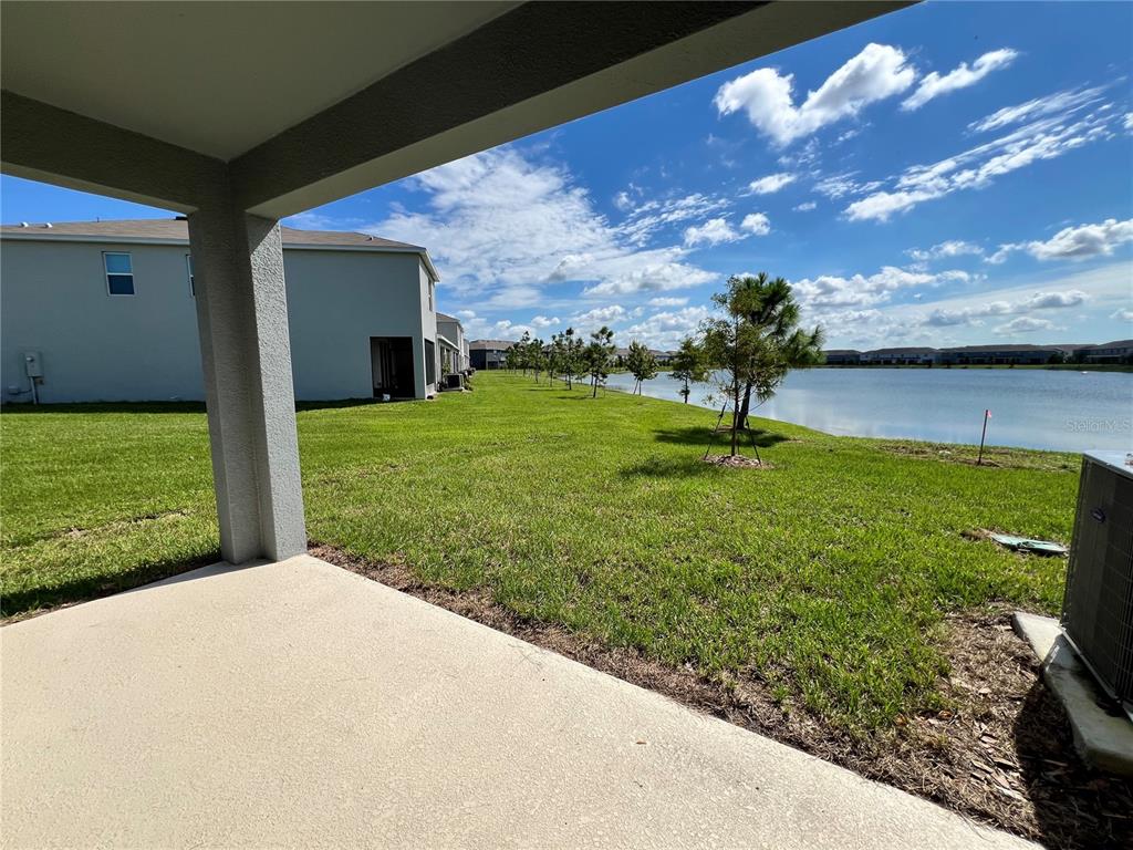 137 Mangrove Shade Circle Apollo Beach, FL 33572 - Photo 8 of 31 a view of a garden from a patio