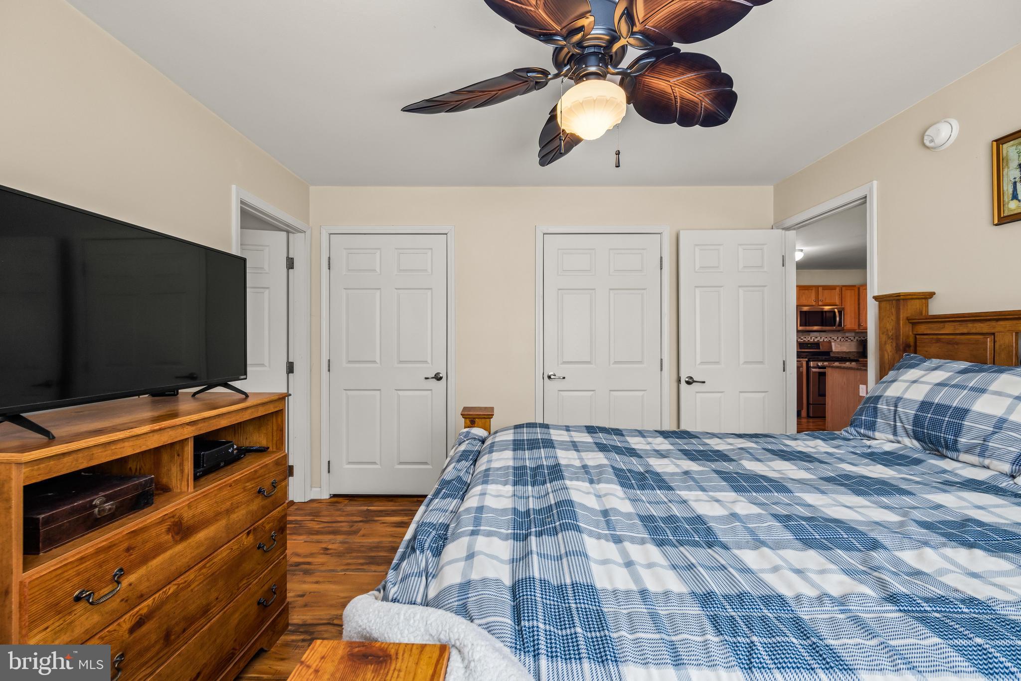 141 Pine Trail Delta, PA 17314 - Photo 12 of 44 a bedroom with a bed and a flat screen tv