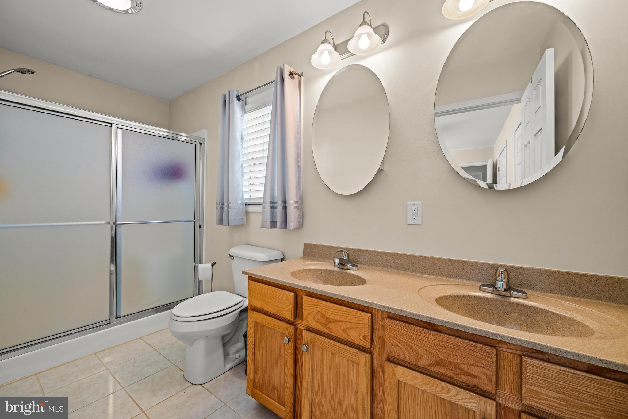141 Pine Trail Delta, PA 17314 - Photo 13 of 44 a bathroom with a granite countertop toilet sink and mirror