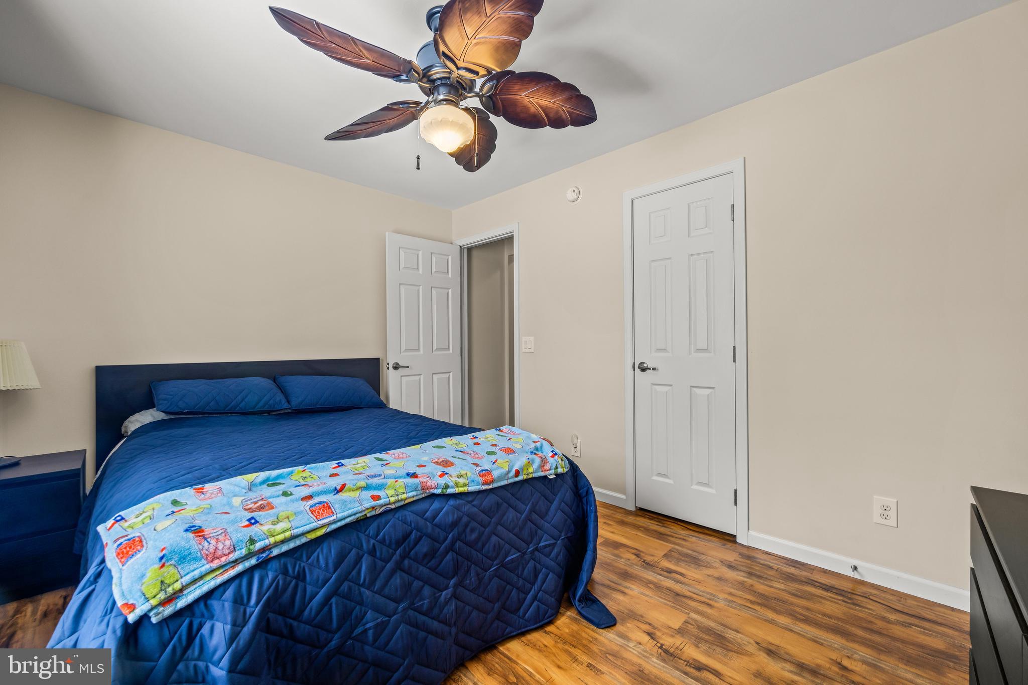 141 Pine Trail Delta, PA 17314 - Photo 18 of 44 a bedroom with a bed and wooden floor