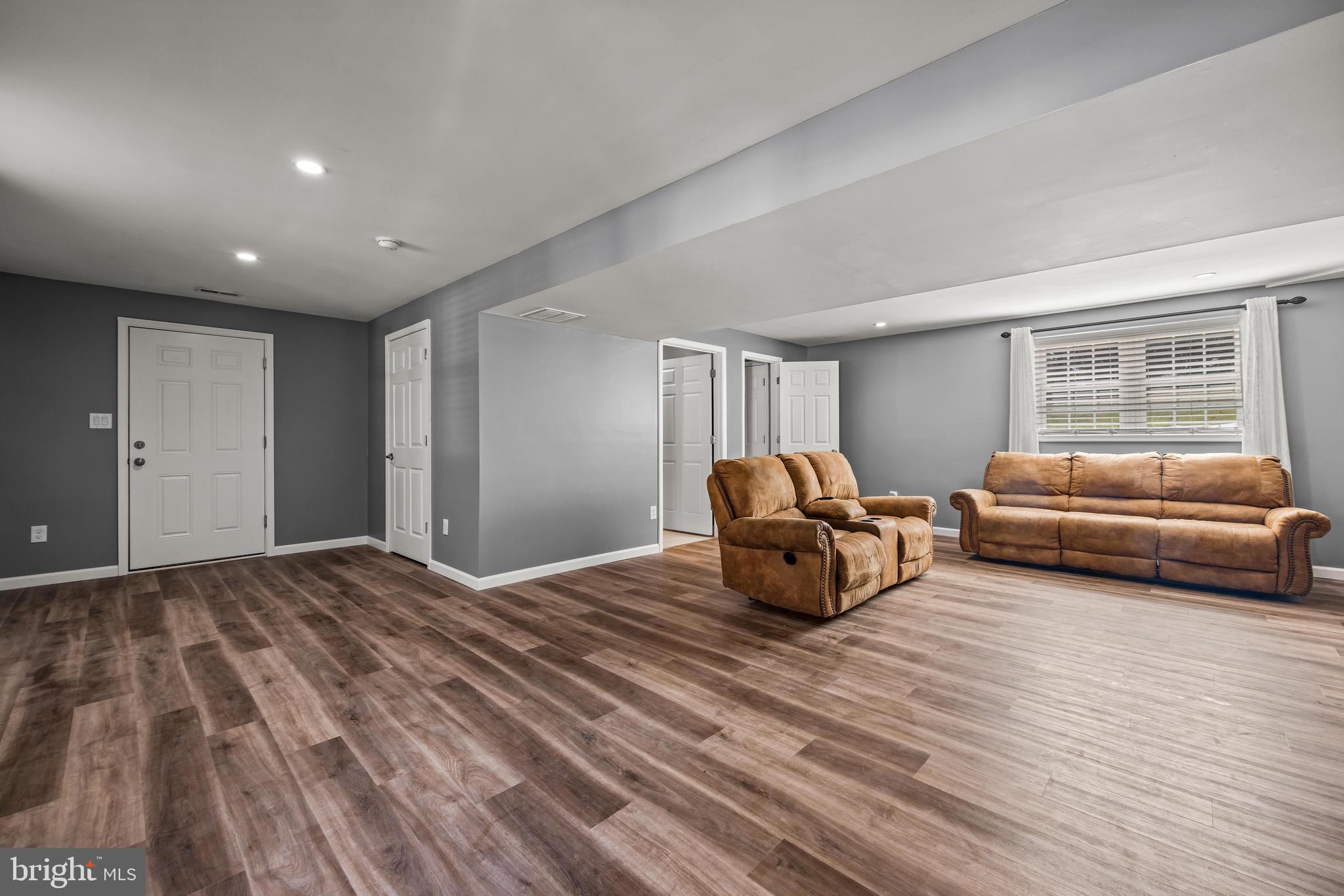 141 Pine Trail Delta, PA 17314 - Photo 23 of 44 a bedroom with a bed and a couch