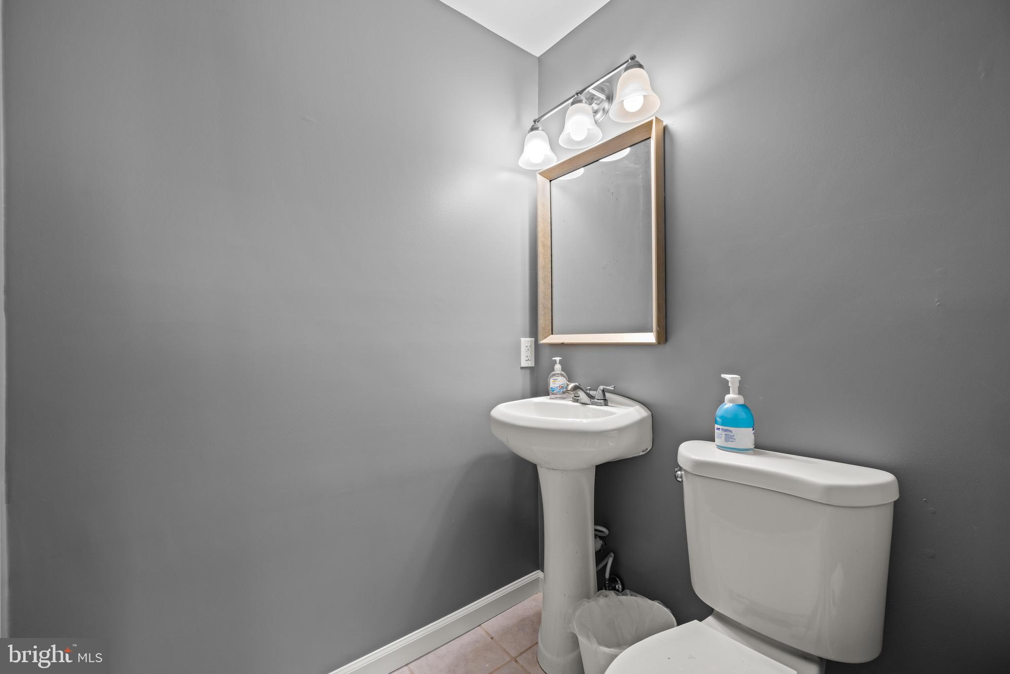 141 Pine Trail Delta, PA 17314 - Photo 24 of 44 a bathroom with a toilet sink and mirror