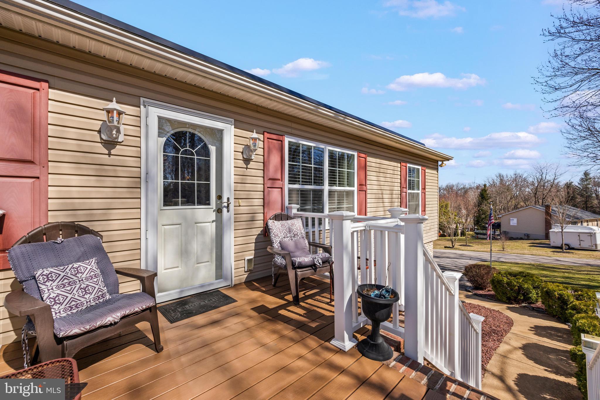 141 Pine Trail Delta, PA 17314 - Photo 30 of 44 a view of a patio with a table and chairs