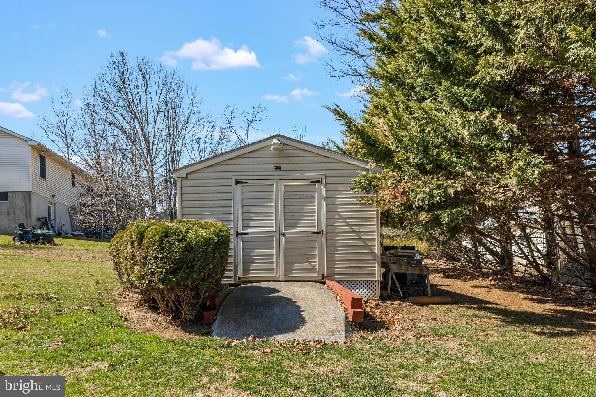 141 Pine Trail Delta, PA 17314 - Photo 34 of 44 a view of a house with a yard