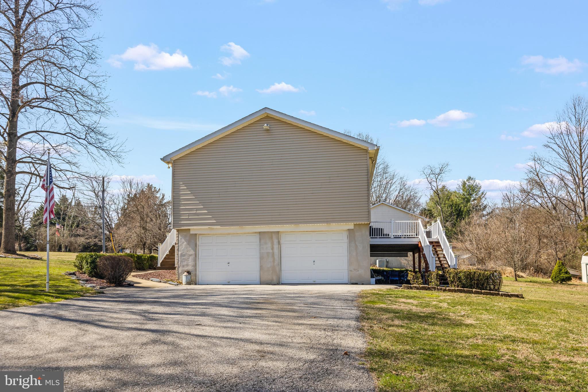 141 Pine Trail Delta, PA 17314 - Photo 44 of 44 a front view of a house with a yard and garage