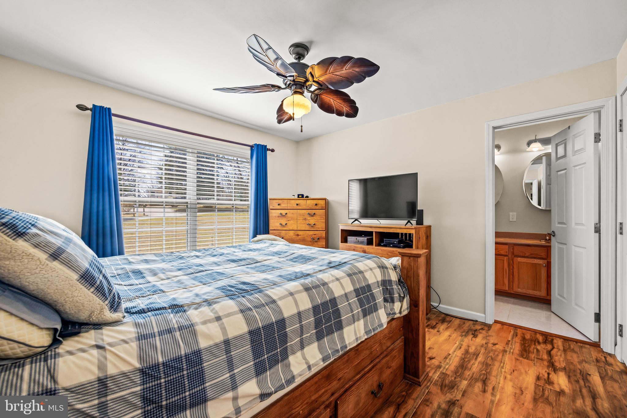 141 Pine Trail Delta, PA 17314 - Photo 10 of 44 a bedroom with a bed and a flat screen tv