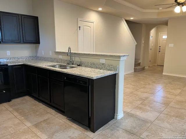 a kitchen with a sink and a cabinets