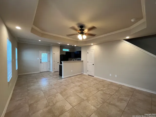 a view of a livingroom with a kitchen