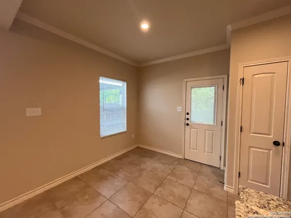a view of an empty room and window