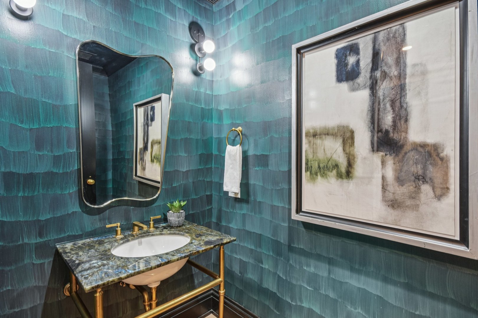 1109 West Washington Boulevard, Unit 8A Chicago, IL 60607 - Photo 19 of 51 a bathroom with a granite countertop sink a mirror and a shower