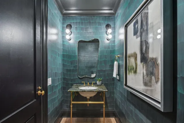 a bathroom with a mirror and a shower