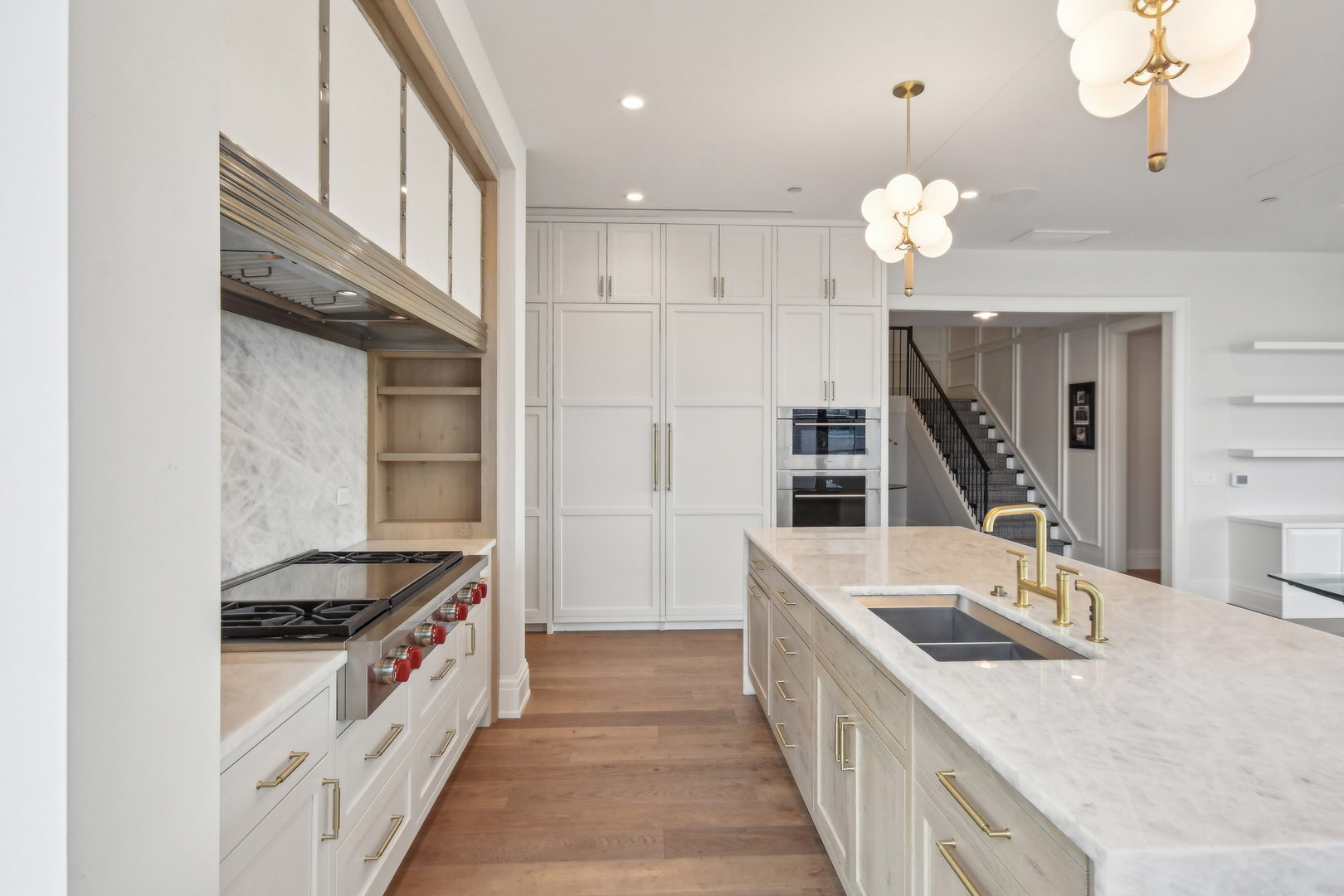 1109 West Washington Boulevard, Unit 8A Chicago, IL 60607 - Photo 24 of 51 a kitchen with a stove a sink and a refrigerator