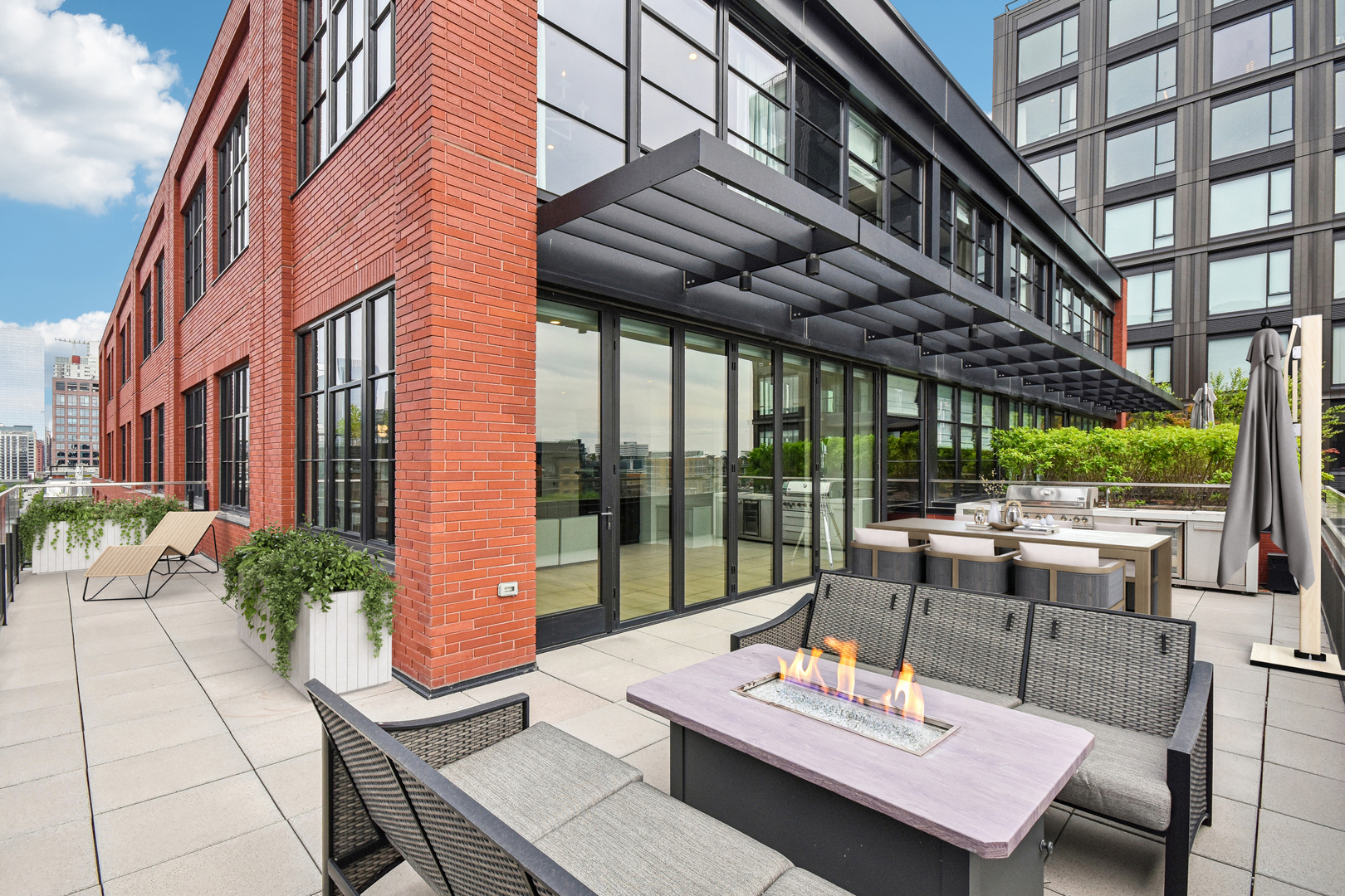 1109 West Washington Boulevard, Unit 8A Chicago, IL 60607 - Photo 4 of 51 a outdoor space with the couches and dining table with the garden view