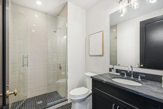 a picture of a bathroom with a shower
