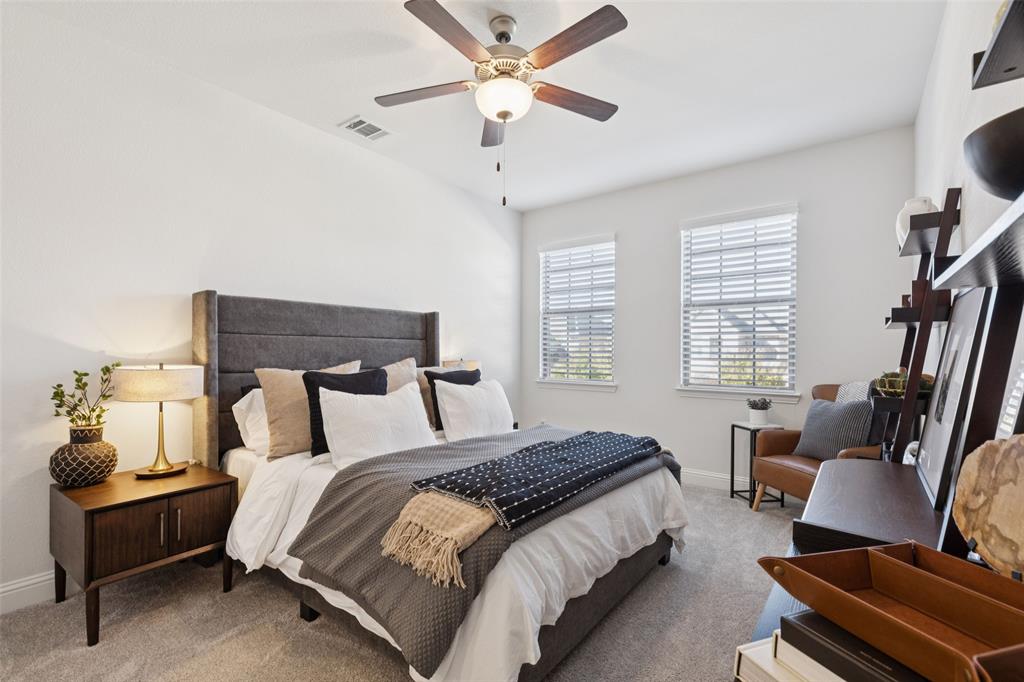 2236 Madison Street Carrollton, TX 75010 - Photo 14 of 37 a bedroom with bed and window