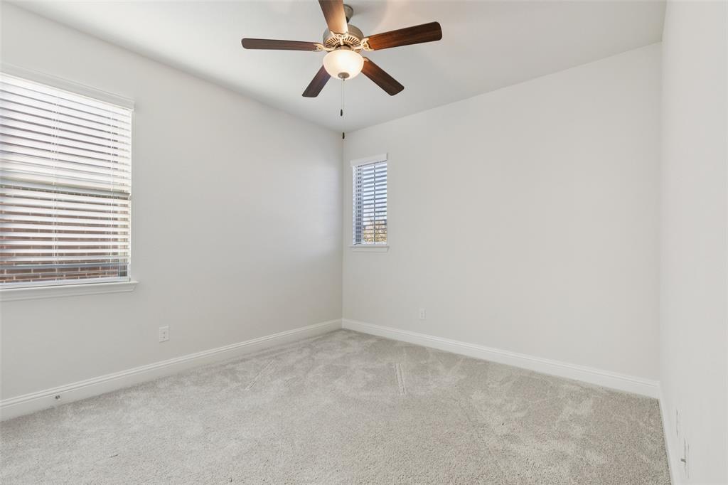 2236 Madison Street Carrollton, TX 75010 - Photo 18 of 37 an empty room with a window and a fan