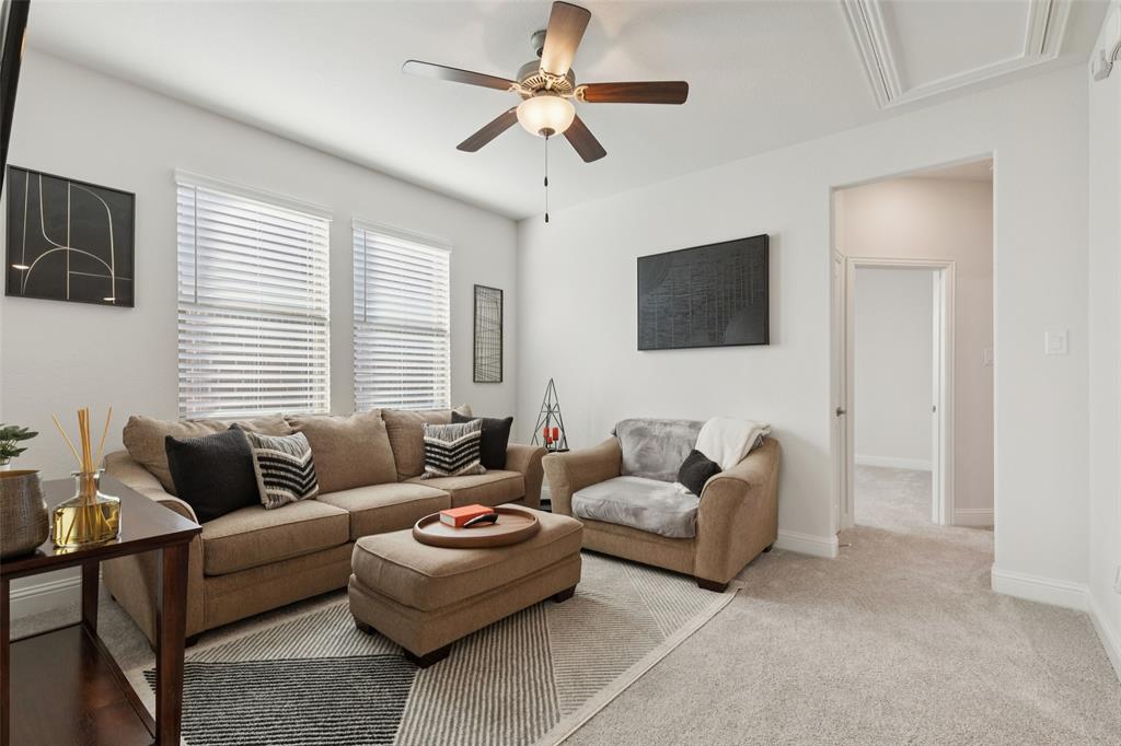 2236 Madison Street Carrollton, TX 75010 - Photo 19 of 37 a living room with furniture and a flat screen tv