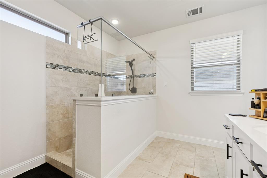 2236 Madison Street Carrollton, TX 75010 - Photo 25 of 37 a bathroom with a sink and mirror