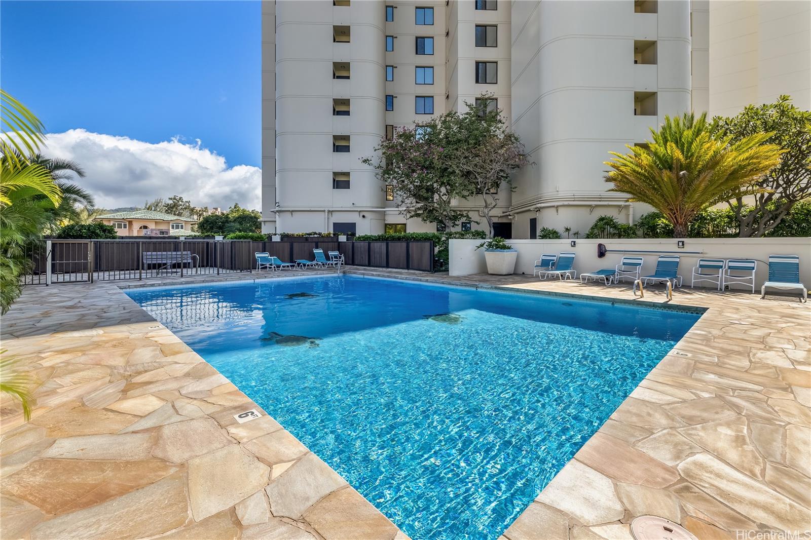 990 Ala Nanala Street, Unit 17A Honolulu, HI 96818 - Photo 13 of 24 a swimming pool with outdoor seating and yard