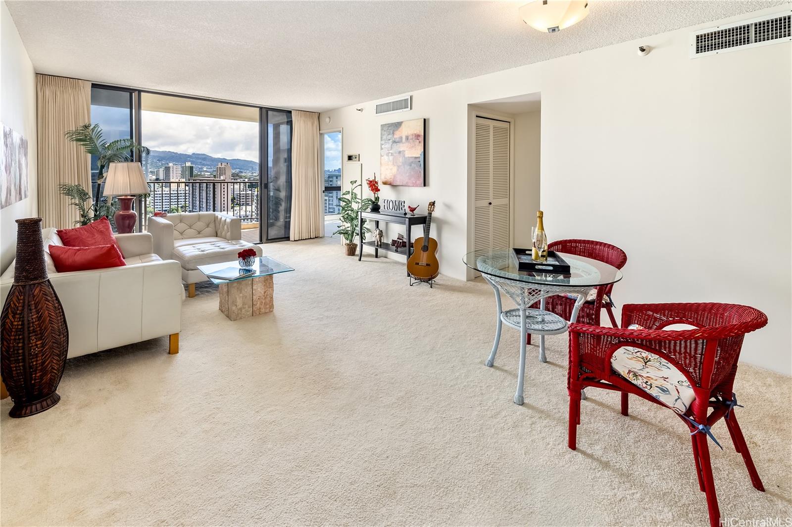 990 Ala Nanala Street, Unit 17A Honolulu, HI 96818 - Photo 21 of 24 a living room with furniture and a window