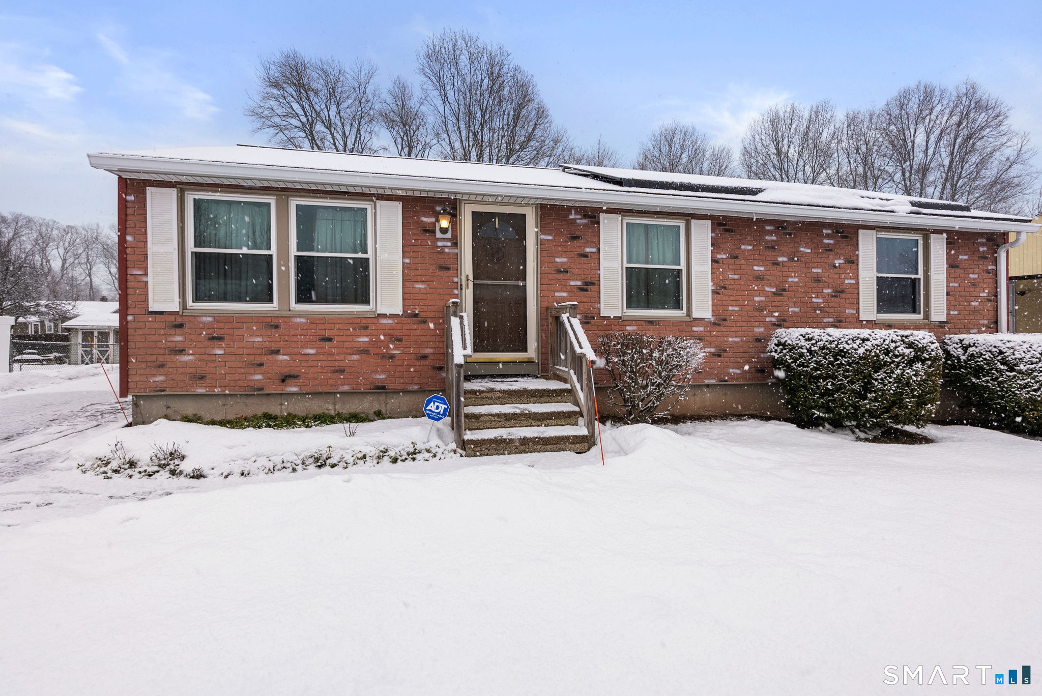 23 Farmstead Circle Bloomfield, CT 06002 - Photo 2 of 23 a front view of a house with a yard