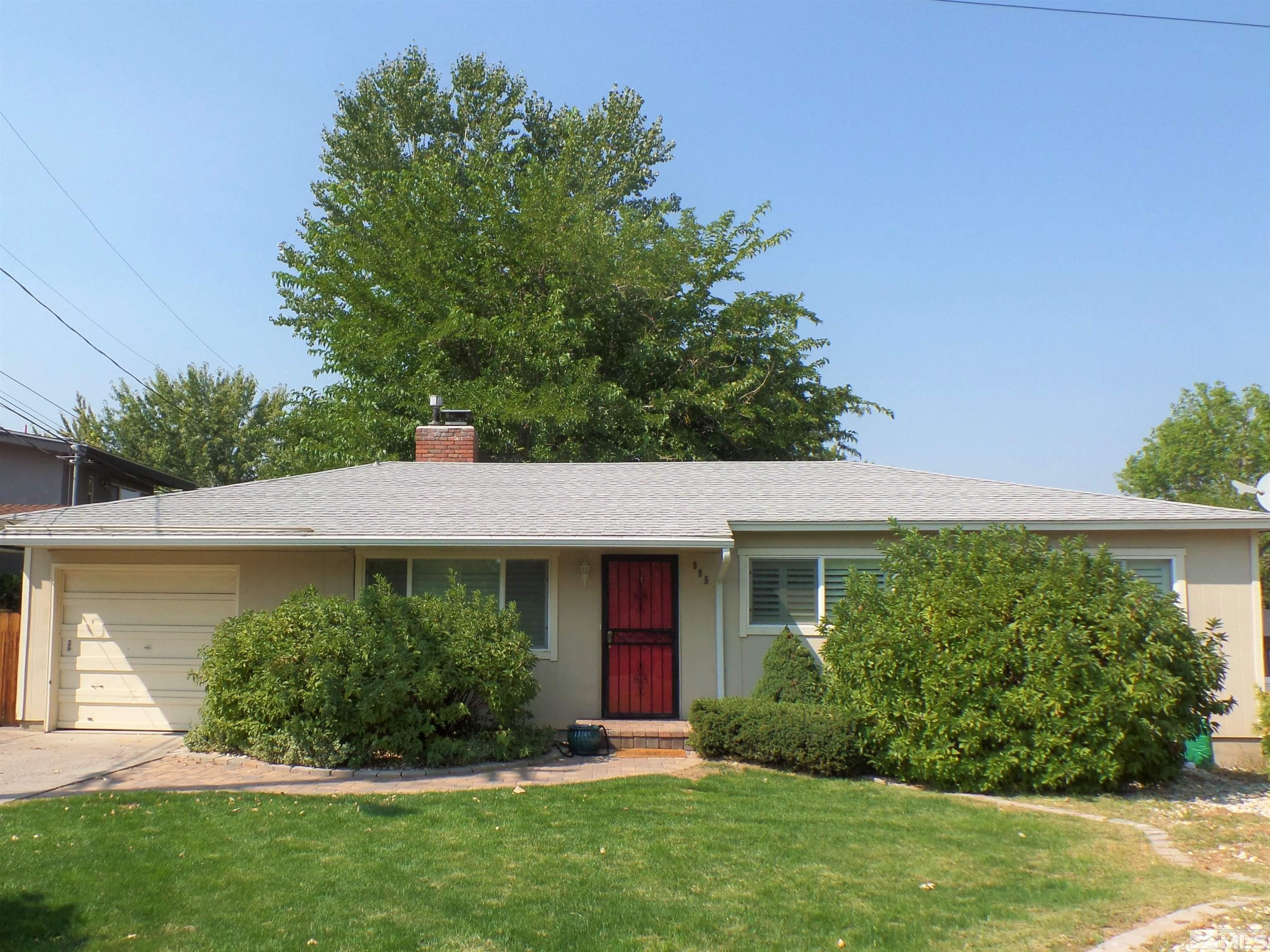 995 Memory Lane Reno, NV 89509 - Photo 1 of 33 front view of a house with a yard