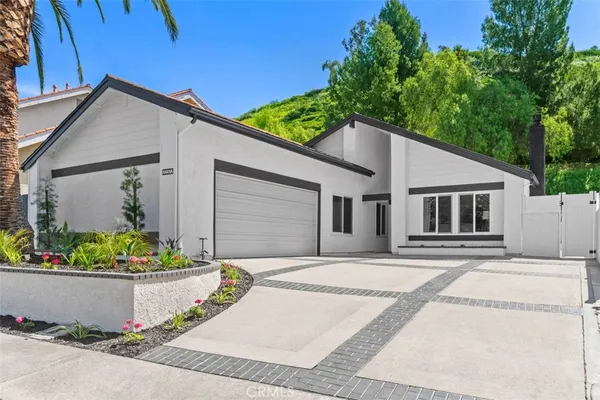 a house with trees in the background
