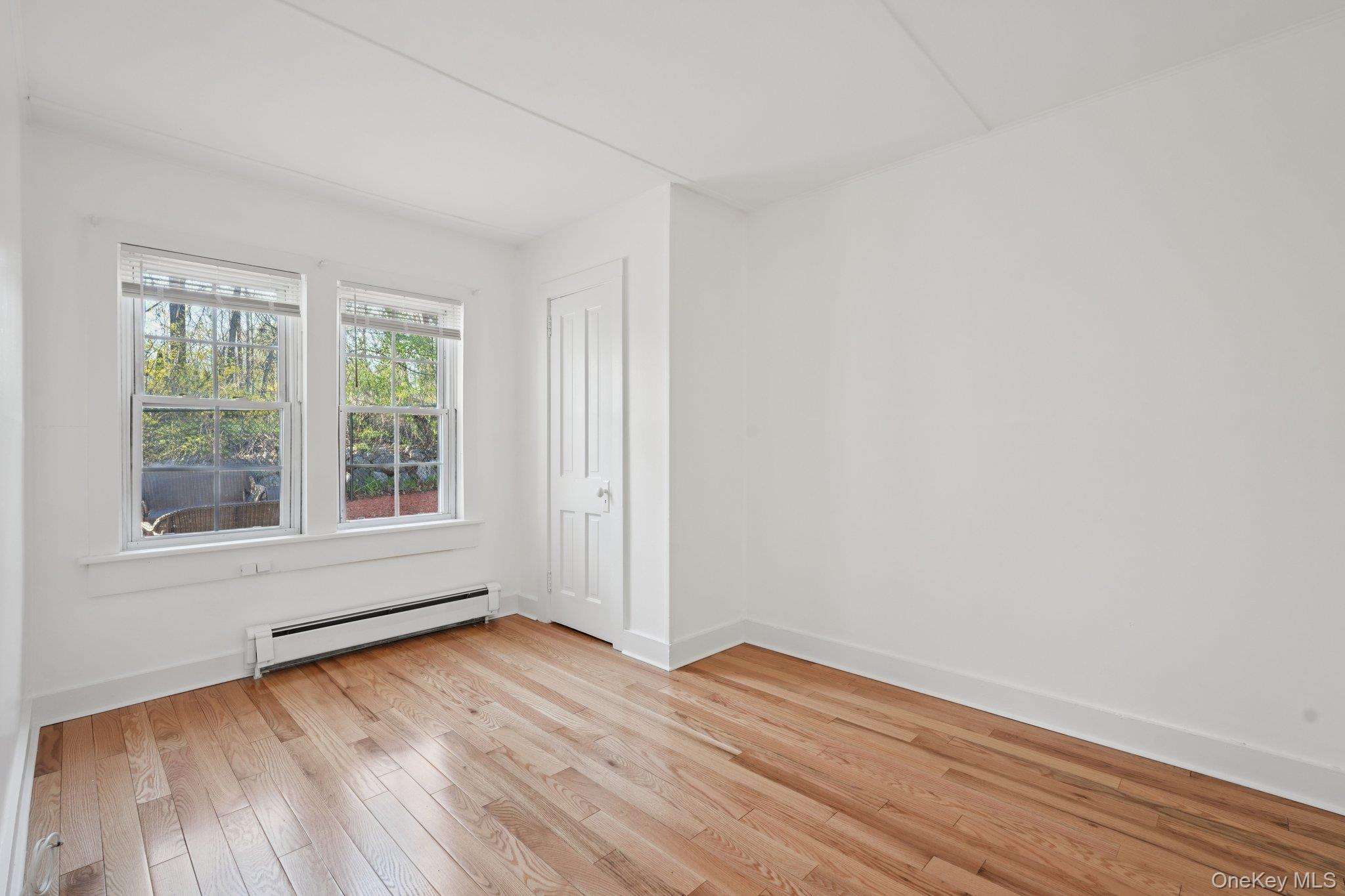 17 Pine Hill Road Highland Mills, NY 10930 - Photo 14 of 35 Bedroom with baseboard heating and light hardwood flooring