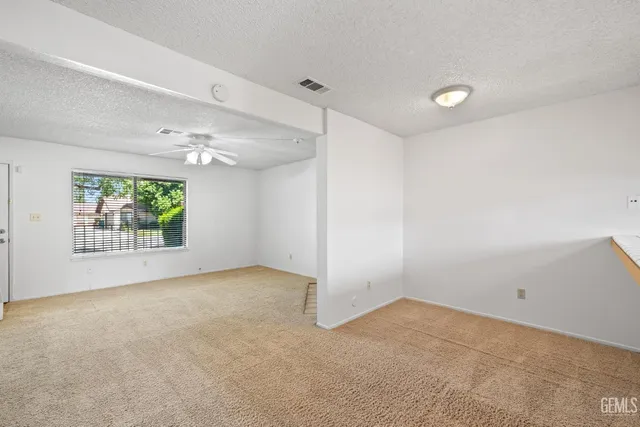 a kitchen with stainless steel appliances granite countertop a sink and a granite counter tops