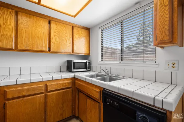 a kitchen that has a sink and a stove