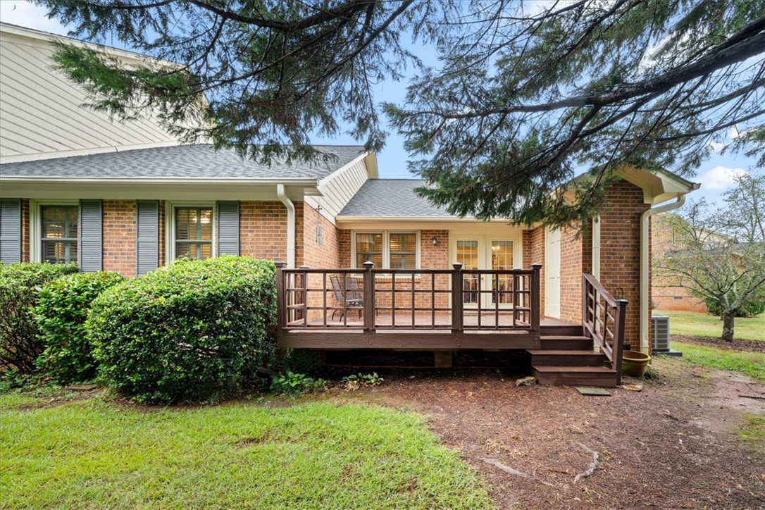 2004 Cardinal Park Drive Anderson, SC 29621 - Photo 40 of 40 A spacious wooden deck extends from the brick and siding exterior of this inviting home.
