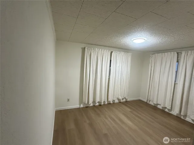 an empty room with wooden floor