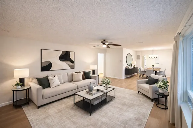 a living room with furniture and a lamp