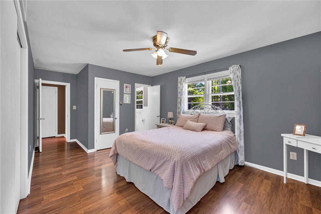 301 Clinkscales Street Iva, SC 29655 - Photo 15 of 36 This inviting bedroom offers warm hardwood floors and abundant natural light.