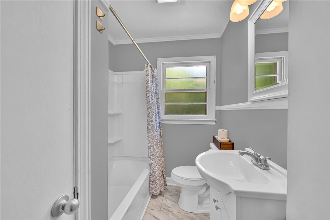 301 Clinkscales Street Iva, SC 29655 - Photo 17 of 36 This bright bathroom features a spacious tub and a window for natural light.