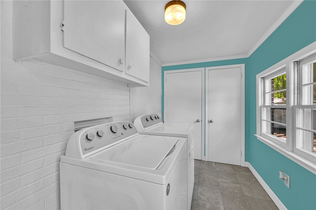 301 Clinkscales Street Iva, SC 29655 - Photo 18 of 36 This functional laundry room features convenient appliances and ample storage for daily tasks.