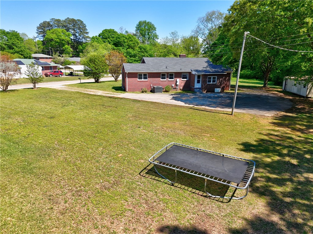301 Clinkscales Street Iva, SC 29655 - Photo 27 of 36 This spacious property features a charming brick residence, a generous yard, and ample outdoor potential.