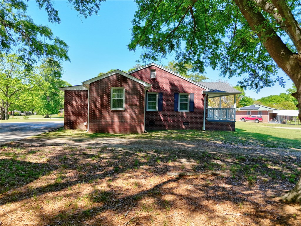 301 Clinkscales Street Iva, SC 29655 - Photo 29 of 36 This classic brick residence offers comfort and timeless appeal amidst lush greenery.